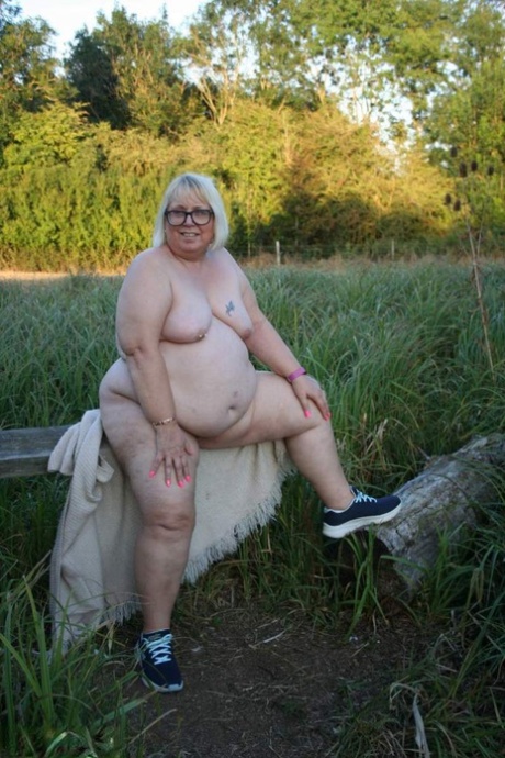Obese British woman Lexie Cummings plays with her snatch in the countryside