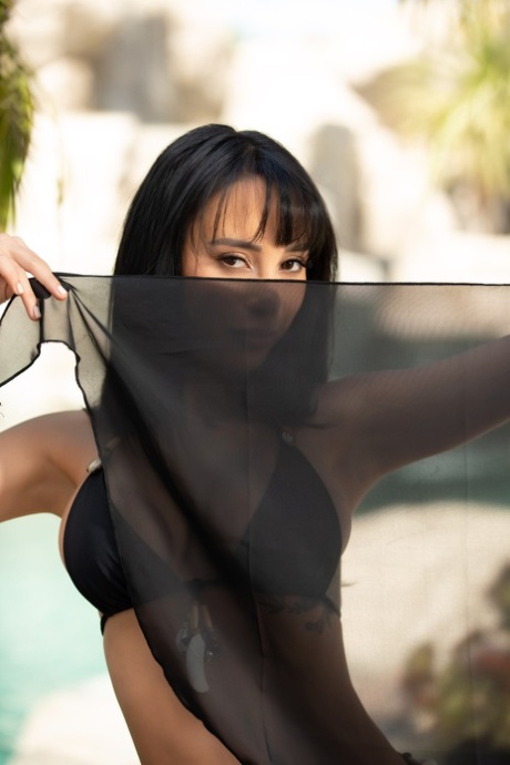 Hot body: Centerfold model Veronica Perasso flaunts her nude, right, in a black bikini.