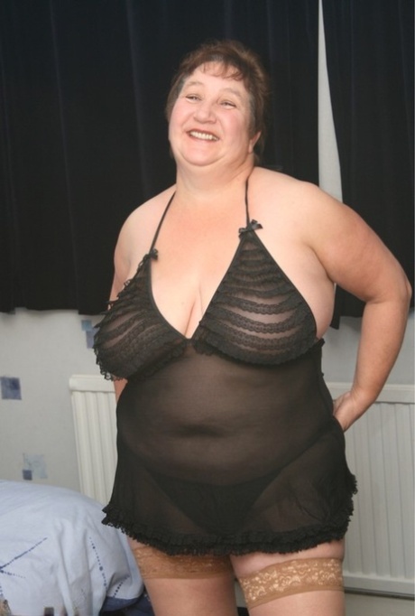 Mature Fatty Kinky Carol Releases Her Huge Tits From Lingerie In Tan Stockings