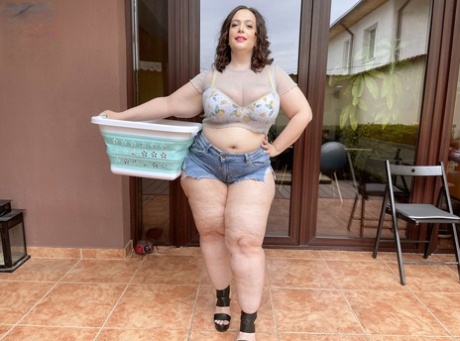 Missing body: Obese brunette Mia Sweetheart, pictured here in the early 2000s, oils up her curvy figure after stripping and getting naked.