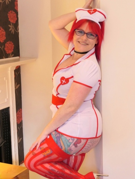 Shown here is Mollie Foxxx, the British nurse who shows off her shaved pussy in suggestive nylon trousers.