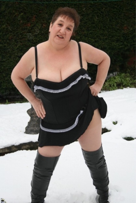 In the snow-covered terrain, Kinky Carol, an aged UK fatty animal, seizes her over the knee boots.
