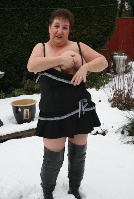 Aged UK Fatty Kinky Carol Strips To Over The Knee Boots On Snow-covered Ground