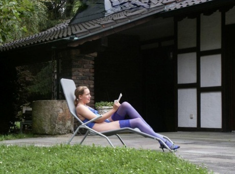 First Timer Nathalie Poses In Purple Stockings On A Patio For Older Men