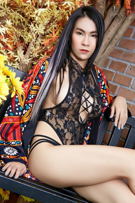 Alluring Asian girl Mintra removes her robe and lingerie in heels
