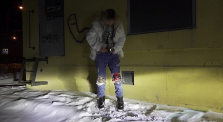 Cute European Pees Over Snow At Nighttime