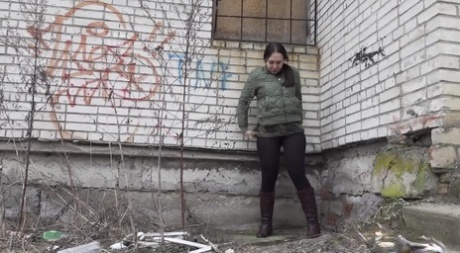 The girl Anya is seen leaving an apartment building for a quick break.