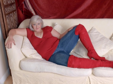 Sustained blonde Samantha releases her large buttocks from denim jeans while wearing suede OTK boots.