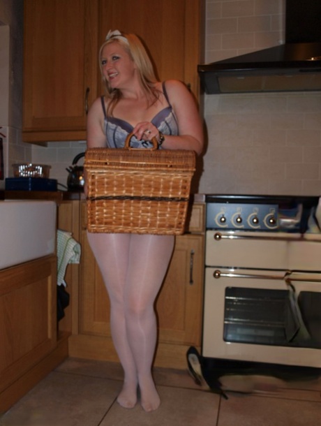 After taking a bite out of the kitchen, Samantha, who is blonde but overweight, spreads her penis around the kitchen.