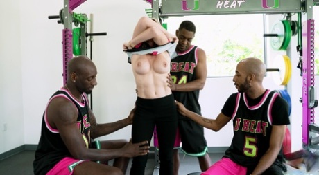 In an interracial gangbang, Cory Chase is involved with basketball players.