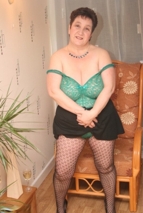 British fatty Kinky Carol strips to her lingerie while wearing patterned hose