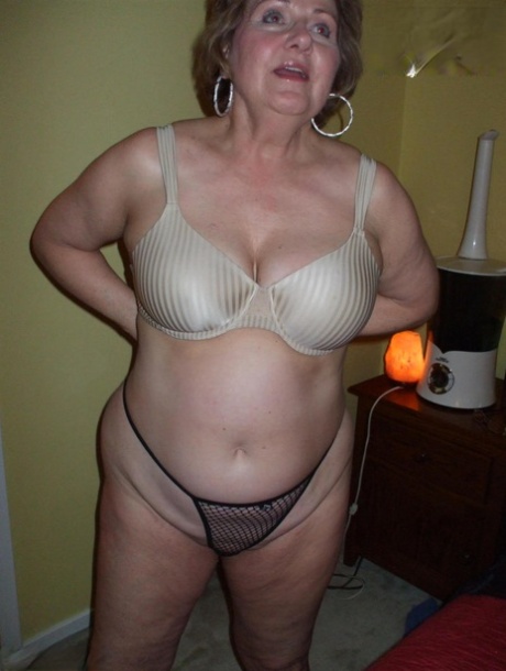 Mature Woman Busty Bliss Uncups Her Natural Tits While Wearing A Black Thong