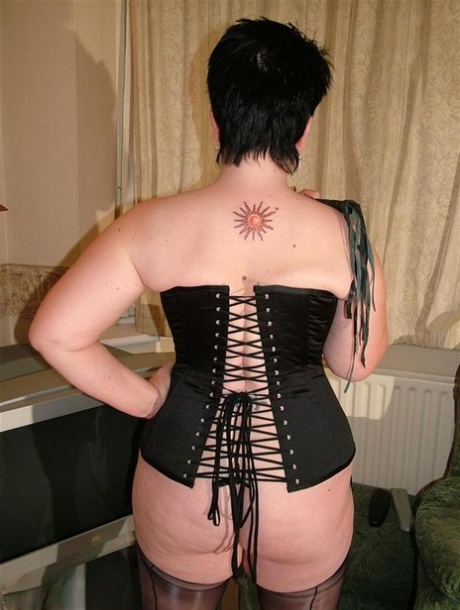 British Pumper Double Dee Models A Back Laced Corset In Nylons And Heels