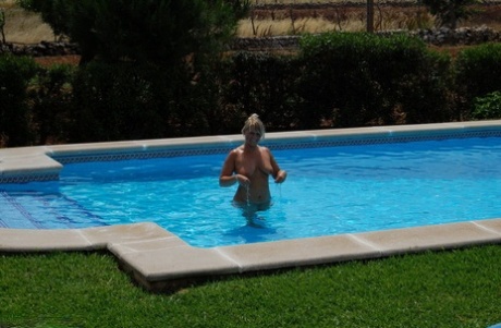 The blonde, Sweet Susi, takes a skinny dip during the day when she is in her middle age.
