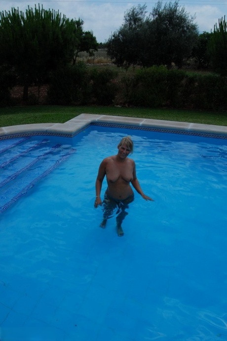 Daytime swim: Middle-aged blonde Sweet Susi gets a skinny dip.