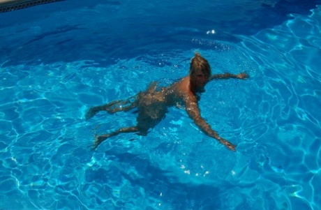 Sweet Susi, who is middle-aged and blonde, enjoys a skinny swim during the day.