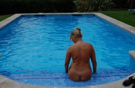 Sweet Susi, a blonde woman of middle age who is currently in her midlife, enjoys a skinny swim during the day.
