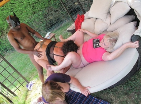 Overweight Women Participate In Interracial Group Sex In A Backyard