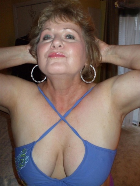 Older lady Busty Bliss frees her natural tits before pulling down her panties