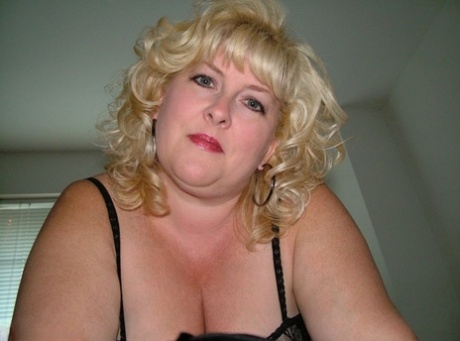 The sexy pantyhose and bra are removed by the blonde BBW Taffy Spanx to expose herself.