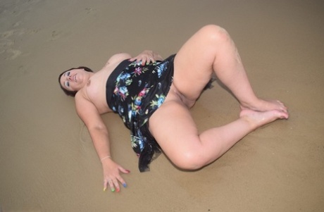 On the run: Young amateur Sara Banks shows off her tits and pus's during a visit to the beach.