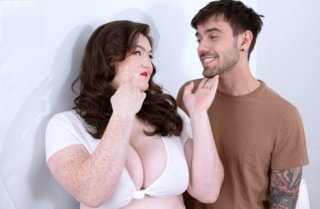During foreplay action, Brunette BBW Nikki Busty displays her big tits and plays with them.