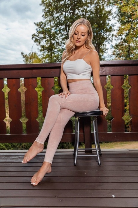 Blonde MILF Serenity Releases Her Great Body From Clothing Out On A Deck