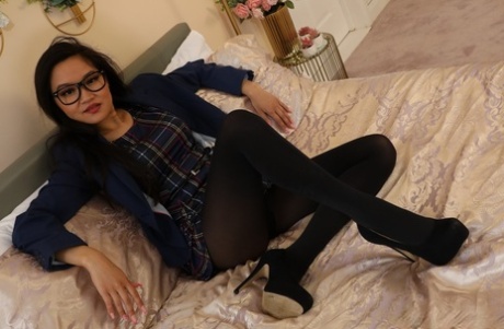 Featuring a plaid minidress, black high heels, and Louisa Lu from Only Opaques wearing the outfit.