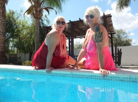 An overweight older blonde girl, Melody is seen kissing her lesbian girlfriend by a pool with her partner.