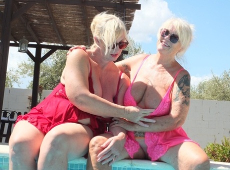 Close: Melody, a fat older blonde girl, kisses her lesbian girlfriend by the pool.