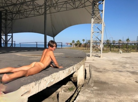 On a concrete stage close to the water, Malika, her first attempt, goes completely naked.