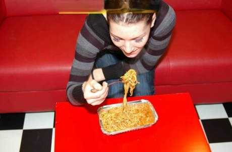 Spaghetti is the ultimate meal for Julia Extrem as she engages in a gangbang.