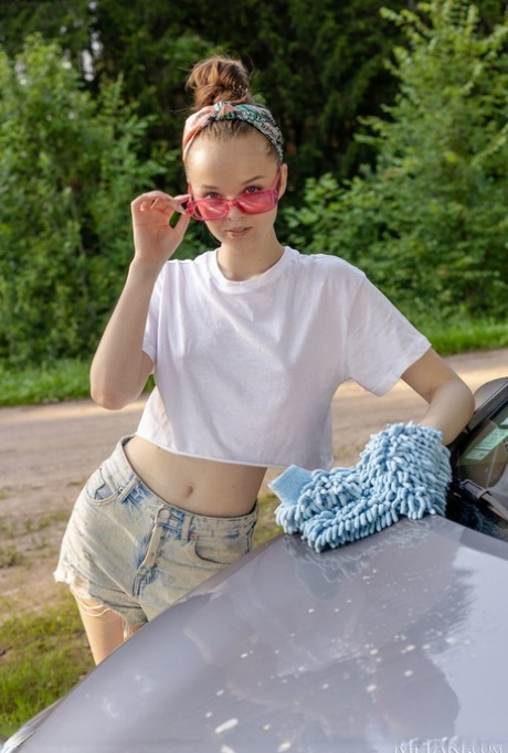 Charming Shea gets completely naked as she shines on a car.