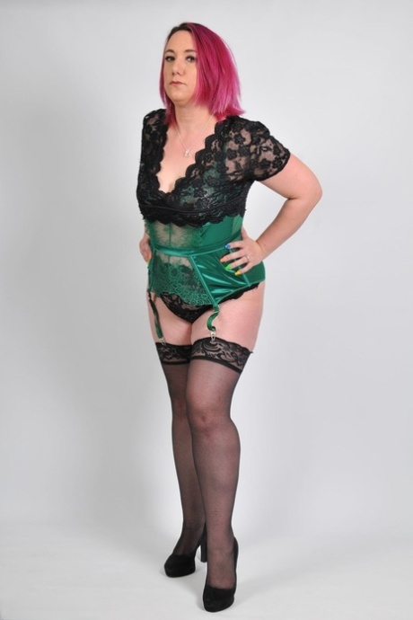 Thick older models modelling lingerie and stockings with a pair of pumps.