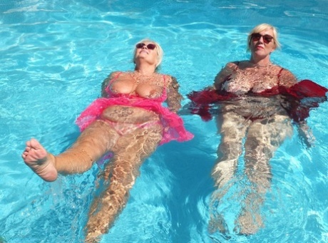 In the middle of a pool, Melody engages in lesbian activity as an older blonde and fat woman.