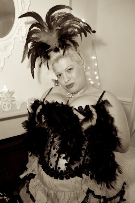 Fatter, older showgirl Dirty Doctor unleashes big breasts into the spotlight in her attire.