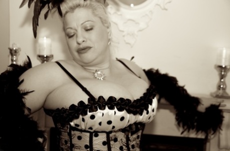 Bigboobs: Fat older showgirl Dirty Doctor unleashes her bigboobs in the back of her outfit.