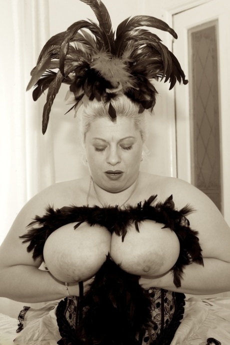 Wearing of showgirl clothes and masturbation, the overweight adult woman named Dirty Doctor.