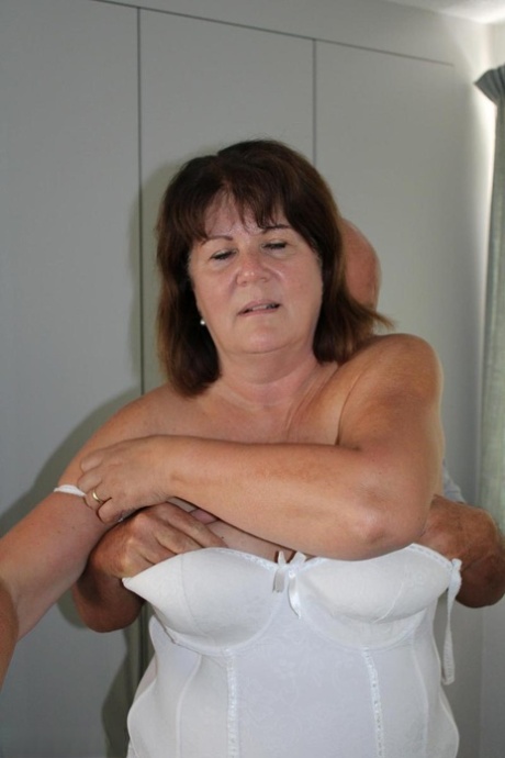 Mature UK woman Cassandra Uk frees her tits from lingerie before a POV blowjob