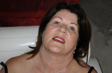 Mature British woman Cassandra Uk wears no underwear in lingerie and nylons