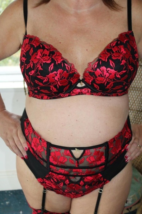 Mature British plumper Cassandra Uk models lingerie and nylons as well