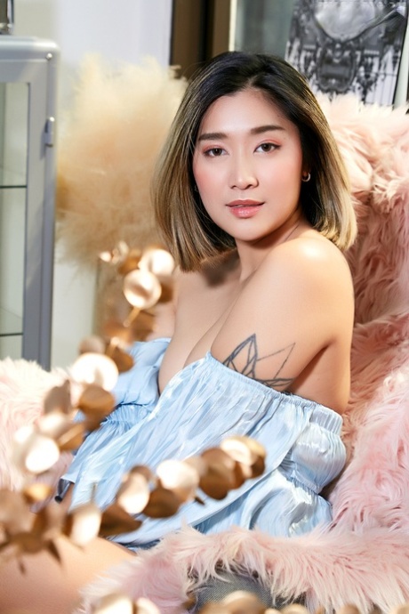 An Asian beauty, Apple proudly shows off her natural pussy during a solo performance.