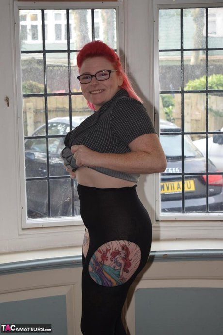 Overweight Redhead Gets Naked While Wearing Glasses And Crotchless Pantyhose