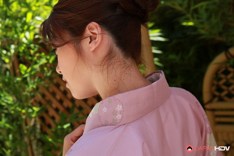 Japanese Beauty Maki Hojo Shows Her Bush While Outdoors In The Garden