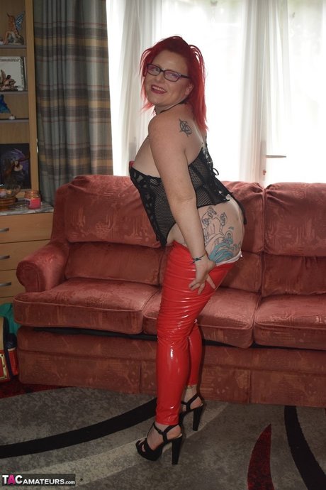 UK Redhead Mollie Foxxx Pulls Down Red Latex Pants During Solo Action