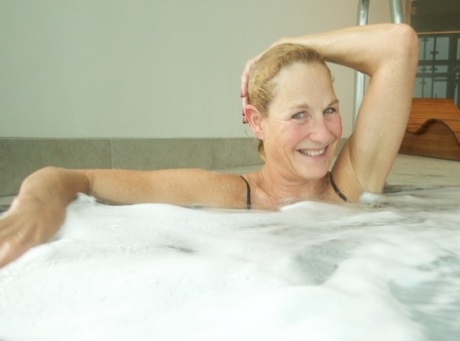 Mature Blonde Molly MILF Sinks Into A Hot Tub While Wearing Lingerie