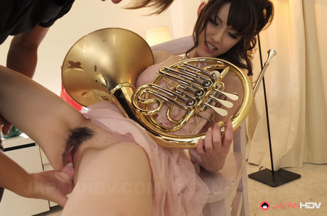 Japanese Girl Kanako Iioka Plays A French Horn While Being Masturbated