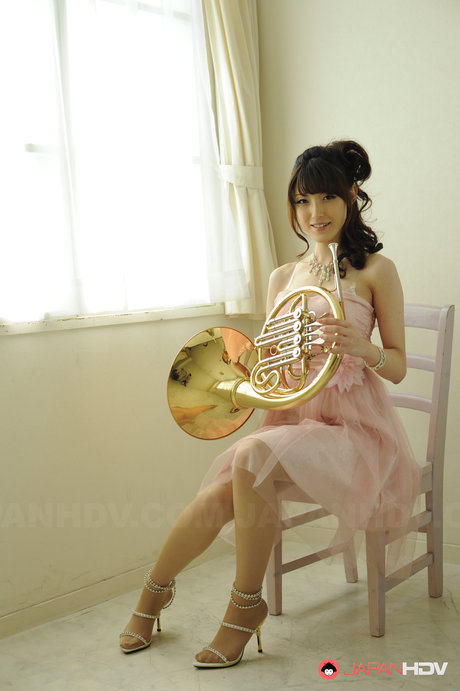 Gorgeous Japanese Girl Kanako Iioka Holds A French Horn While Getting Naked