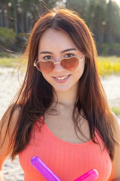 Charming Teen Aura Unveils Her Great Body On An Air Mattress At The Beach