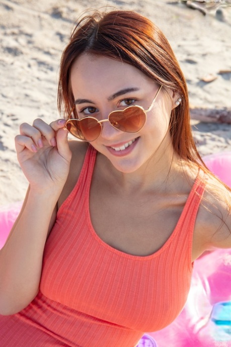 Charming Teen Aura Unveils Her Great Body On An Air Mattress At The Beach